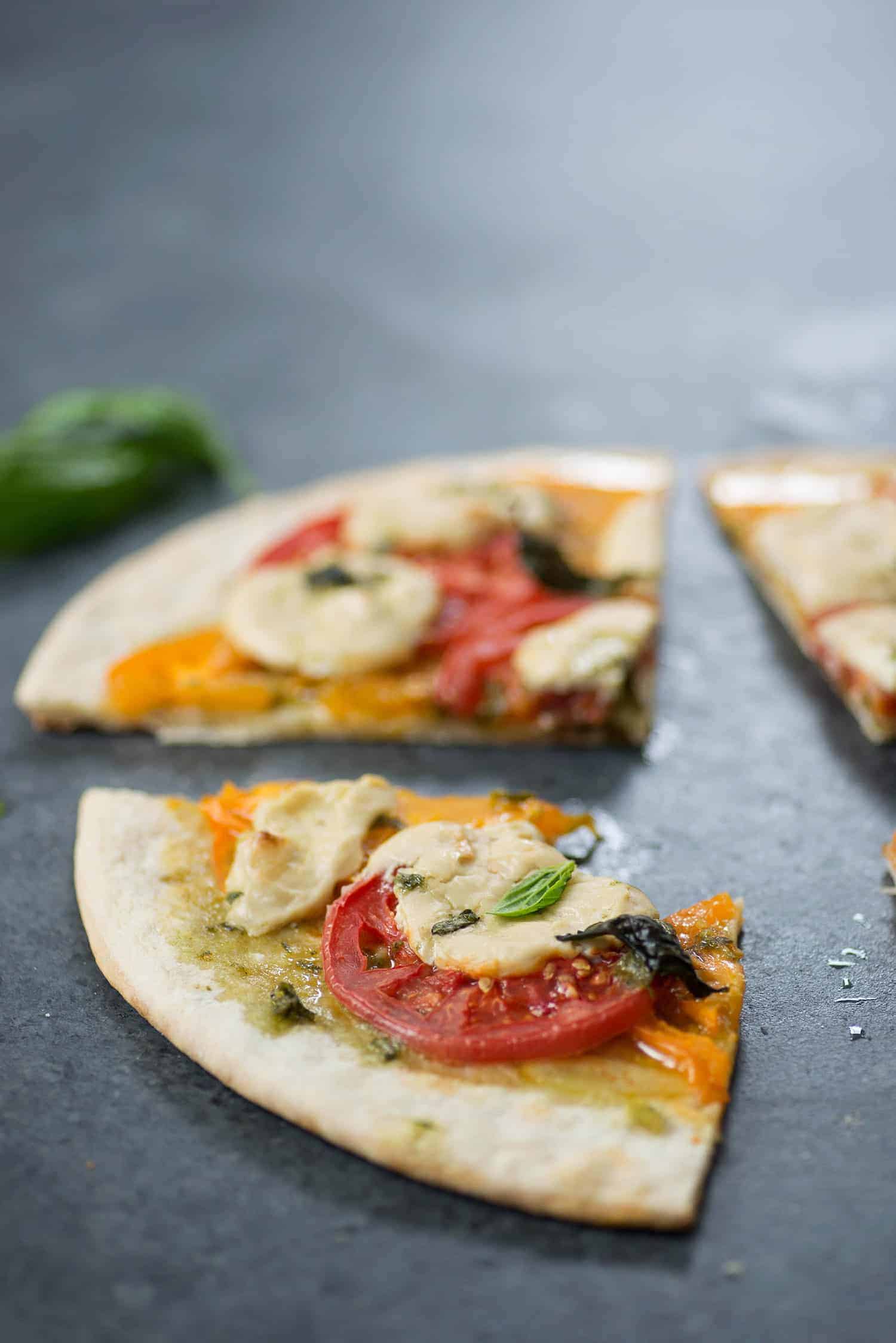 Vegan Pizza! Fresh Margherita Pizza With Cashew Mozzerella Cheese, Heirloom Tomatoes And Fresh Basil. | Www.delishknowledge.com 