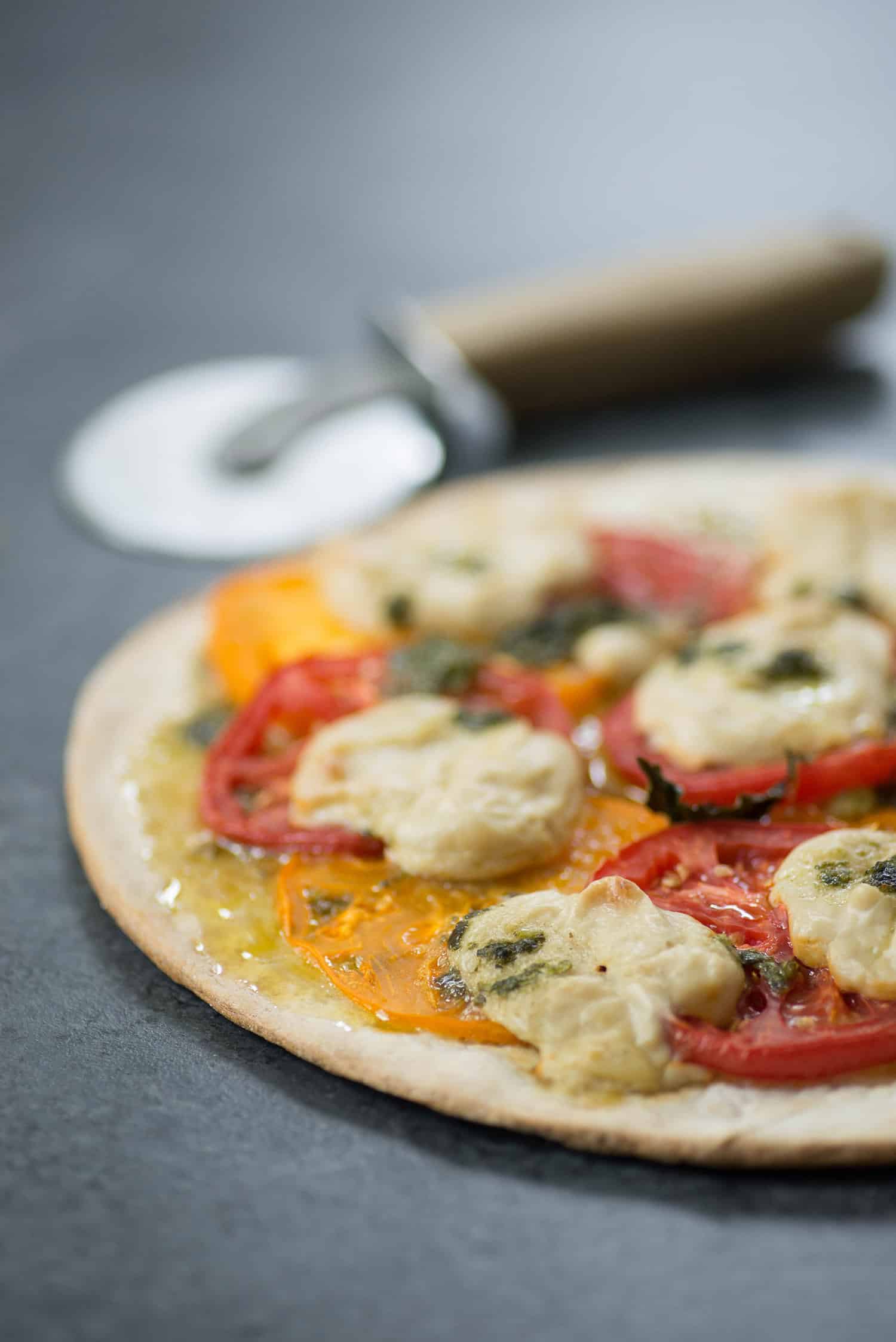 Vegan Pizza! Fresh Margherita Pizza With Cashew Mozzerella Cheese, Heirloom Tomatoes And Fresh Basil. | Www.delishknowledge.com