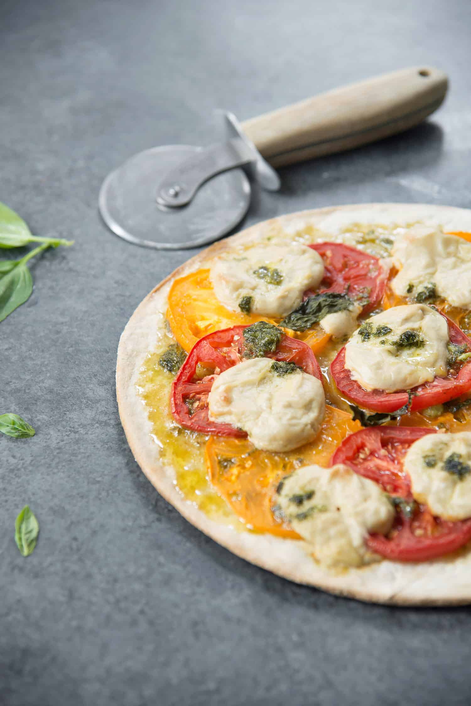 Vegan Pizza! Fresh Margherita Pizza With Cashew Mozzerella Cheese, Heirloom Tomatoes And Fresh Basil. | Www.delishknowledge.com