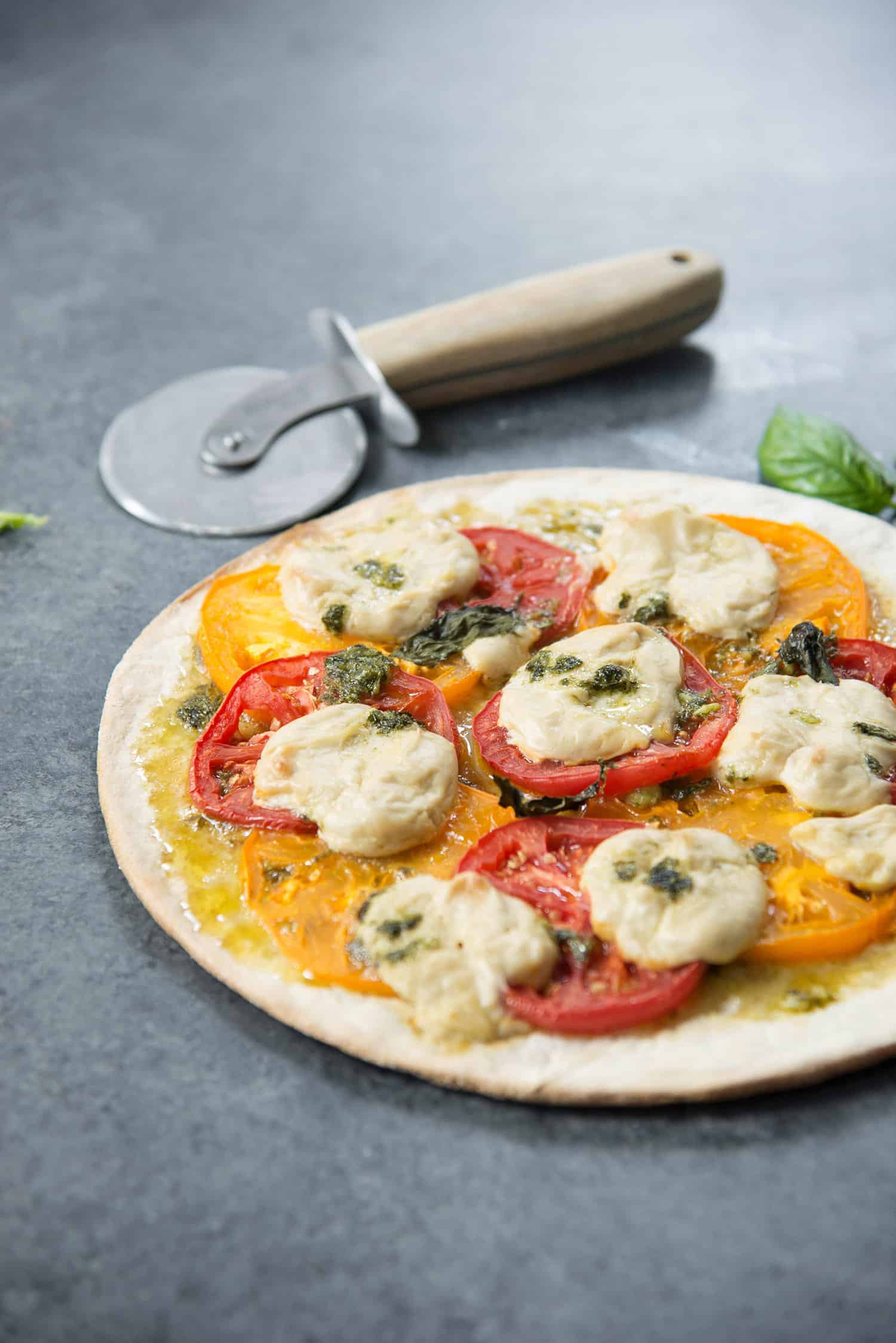 Vegan Pizza! Fresh Margherita Pizza With Cashew Mozzerella Cheese, Heirloom Tomatoes And Fresh Basil. | Www.delishknowledge.com