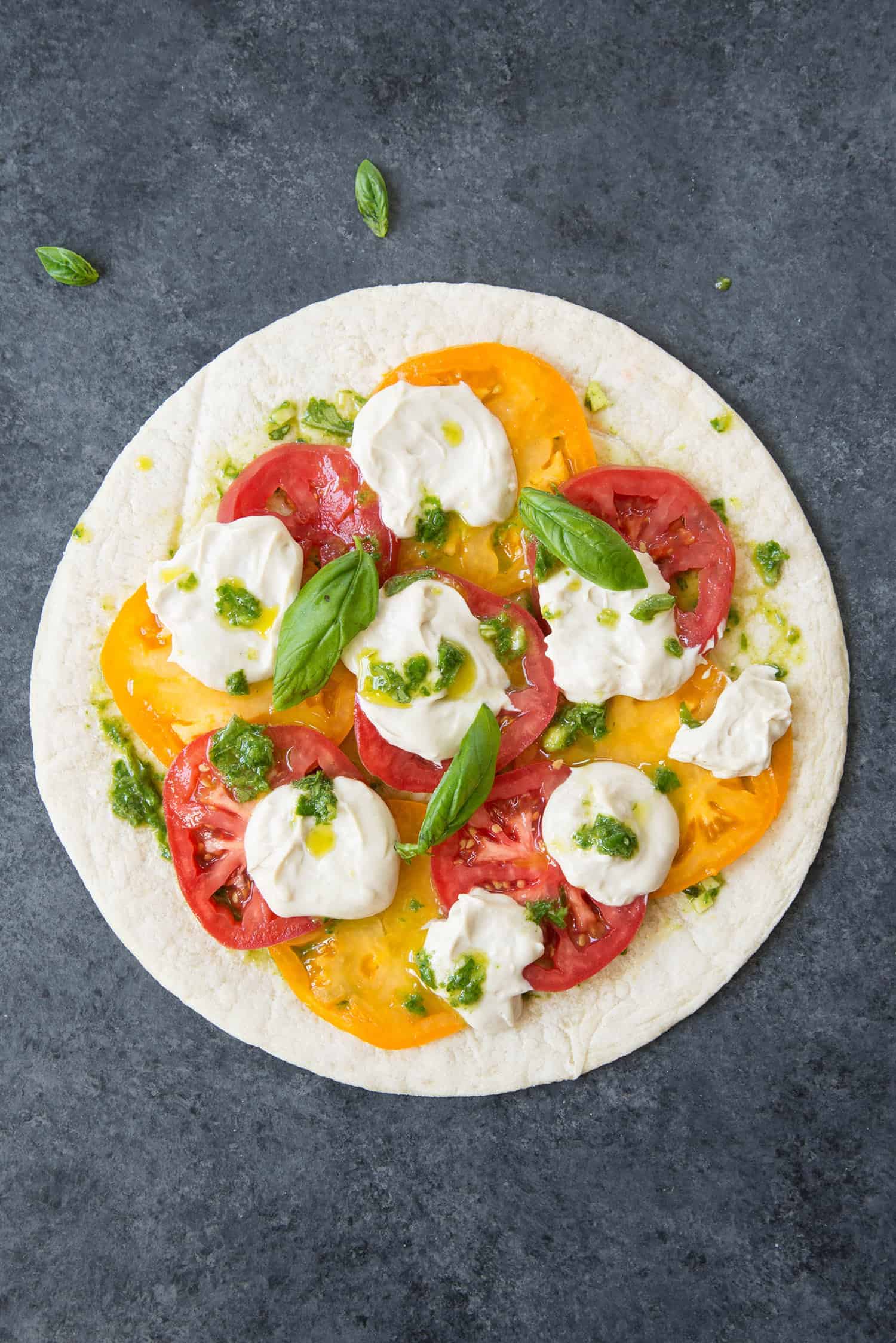 Vegan Pizza! Fresh Margherita Pizza With Cashew Mozzerella Cheese, Heirloom Tomatoes And Fresh Basil. | Www.delishknowledge.com