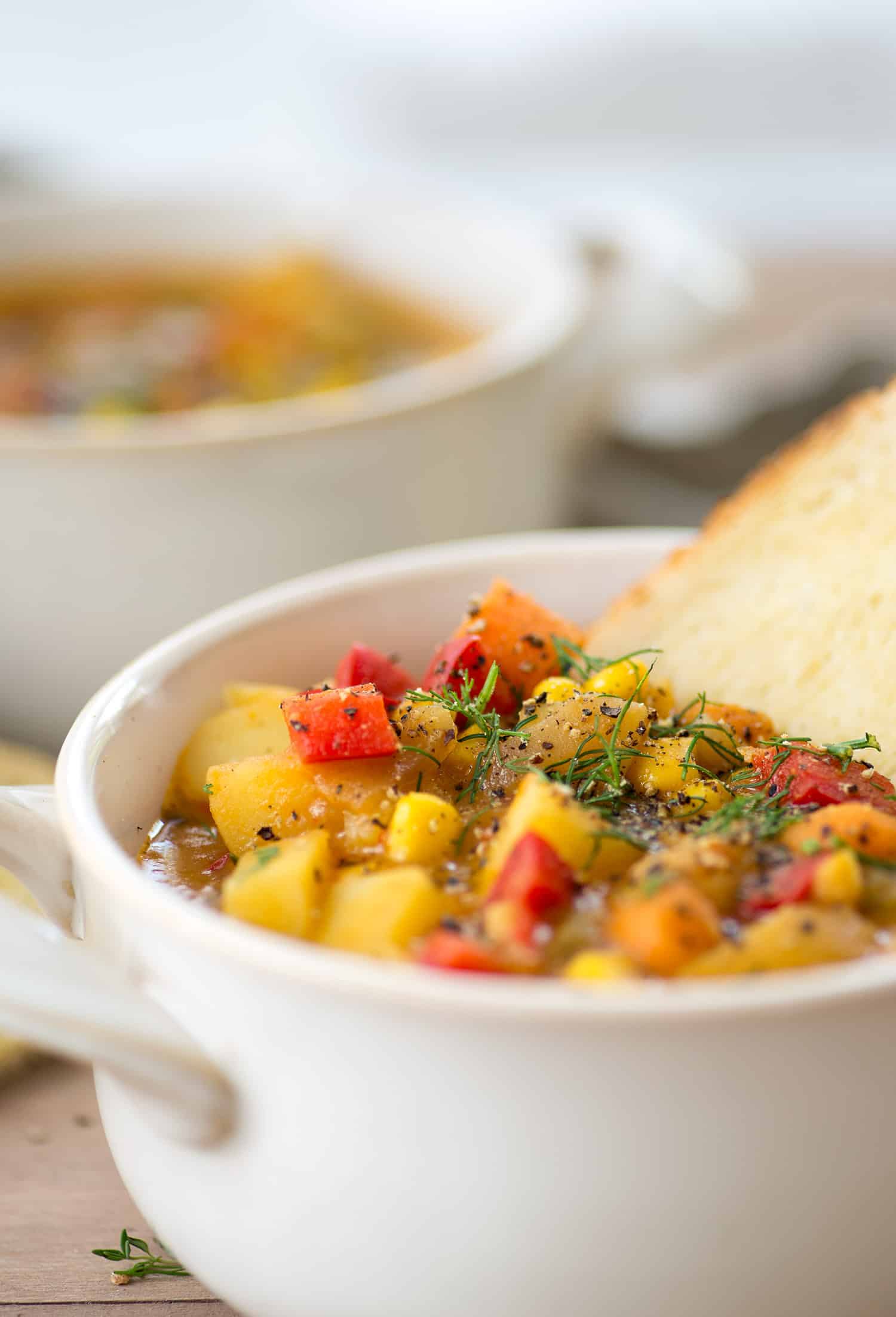 Vegan Vegetable Chowder With Potatoes And A Piece Of Bread