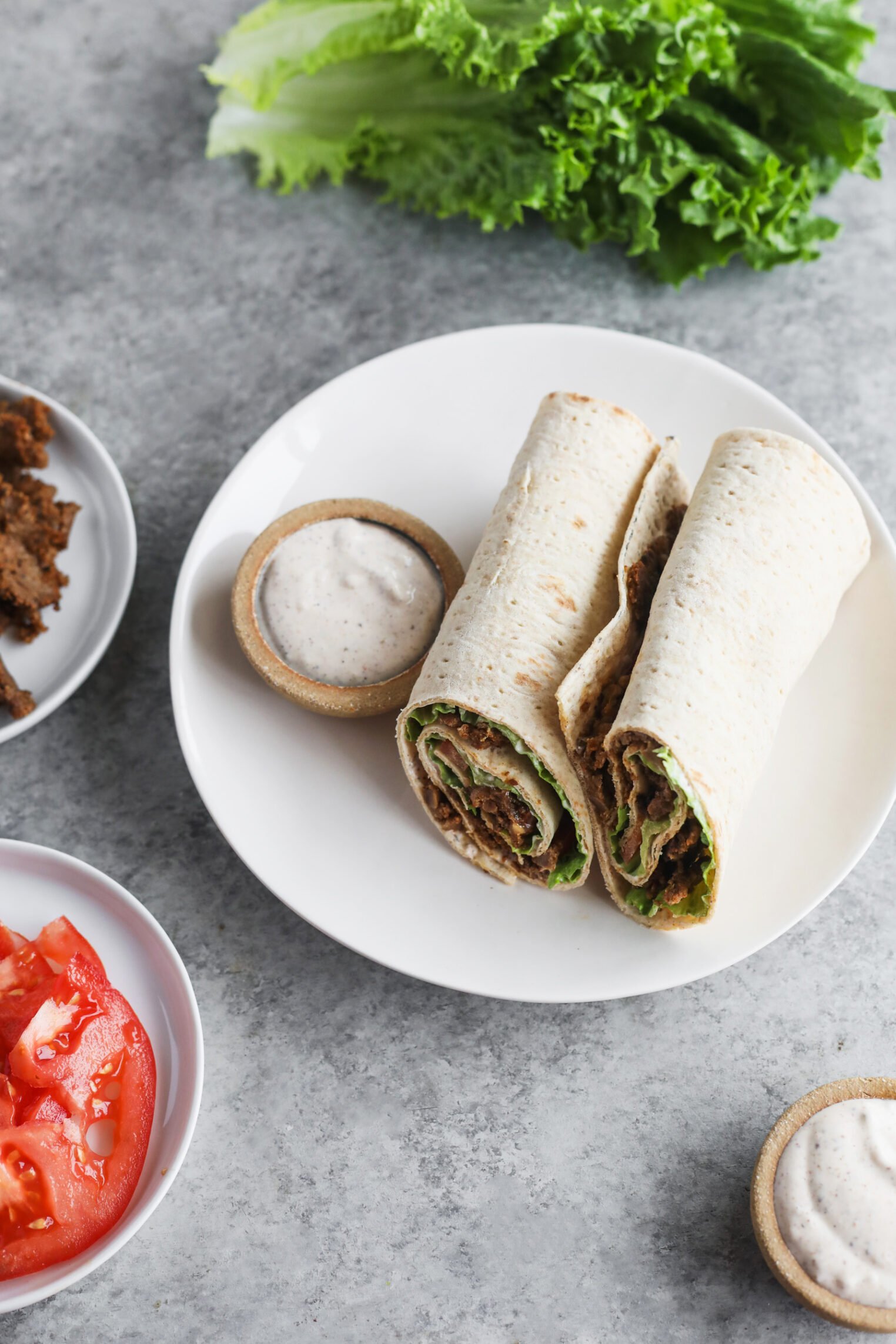 A Plate Of Vegan Doner Kebab Sits On A Table, Ready To Enjoy.