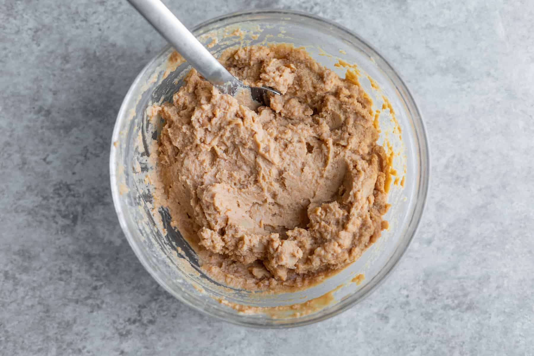 Bowl Of Beans With A Spoon