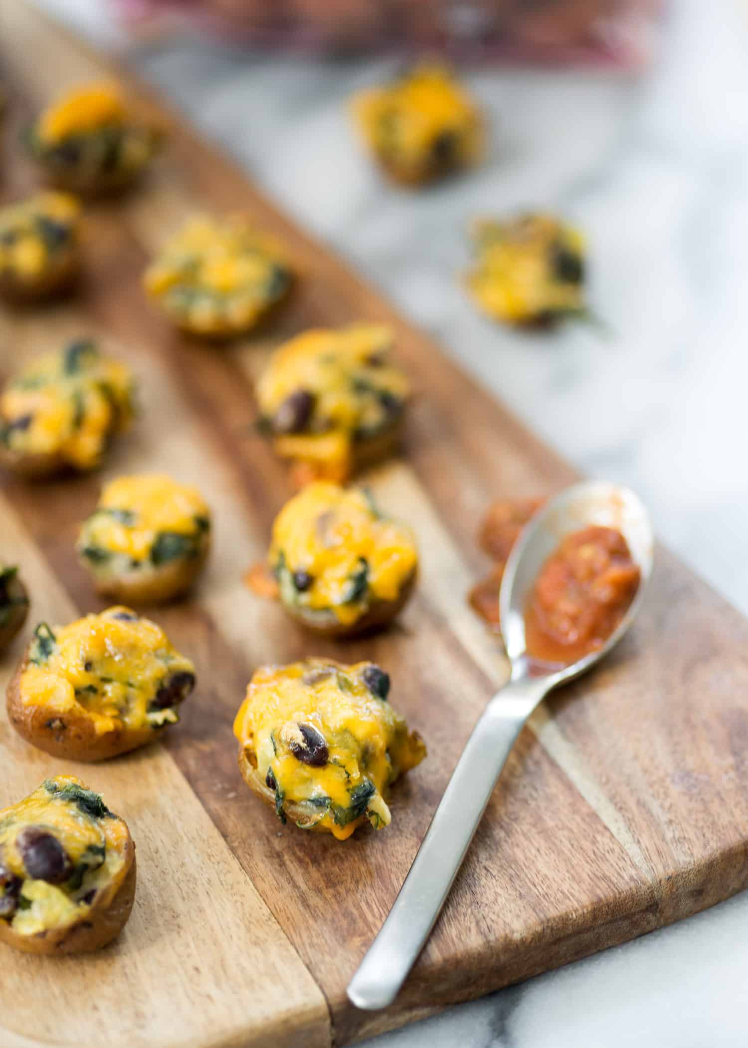 Vegetarian Southwestern Stuffed Potato Skins! Spicy Potato, Beans And Spinach Stuffed Into Potato Skins And Covered With Mexican Cheese. Vegetarian And Gluten-Free | Www.delishknowledge.com