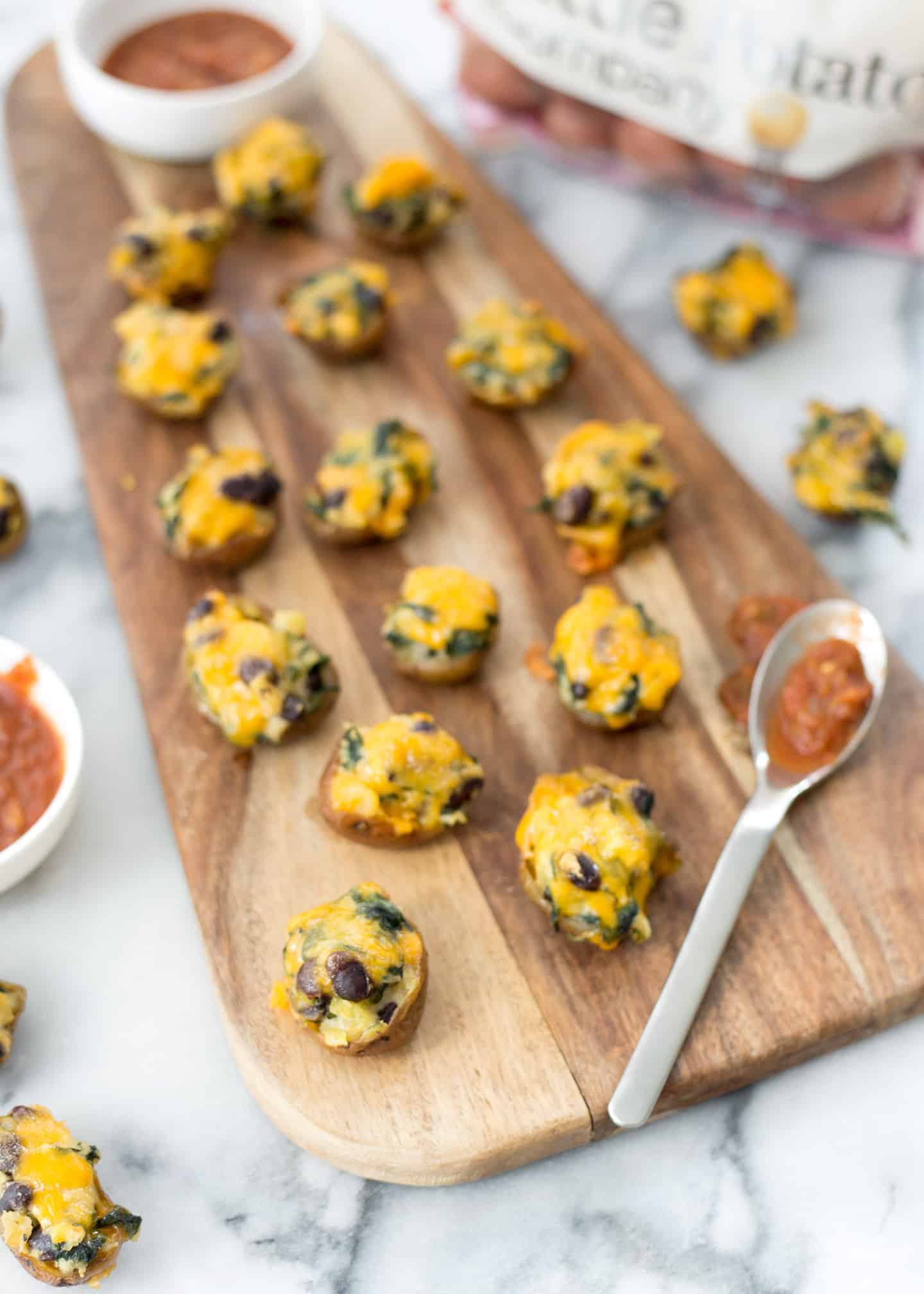 Vegetarian Southwestern Stuffed Potato Skins! Spicy Potato, Beans And Spinach Stuffed Into Potato Skins And Covered With Mexican Cheese. Vegetarian And Gluten-Free | Www.delishknowledge.com