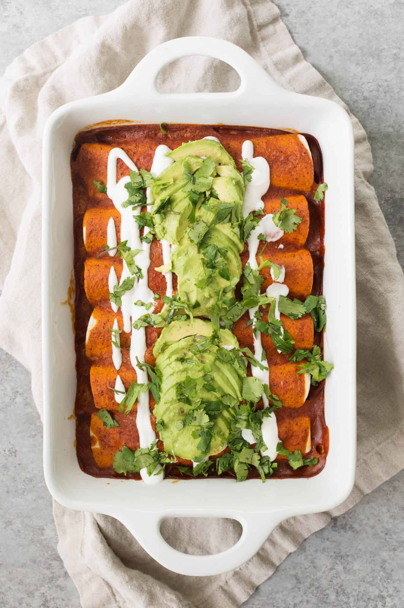 Vegan Fajita Enchiladas! These Enchiladas Are Perfect For Cinco De Mayo. Roasted Peppers, Onions And Beans Covered In A Homemade Enchilada Sauce And Avocado. | Www.delishknowledge.com