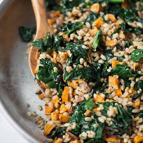 Warm Farro and Kale Salad with Orange Miso Dressing 6 Warm Farro, Squash And Kale Salad With Orange-Miso Dressing! This Vegan Meal Is Super Nourishing And Healthy. Roasted Squash Sauteed With Kale And Farro, Then Tossed In A Silky Orange And Miso Dressing. A Must Make This Winter! | Www.delishknowledge.com
