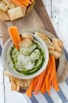 White bean hummus with basil oil drizzle! This low-fat hummus is bursting with fresh flavor, perfect as a dip or spread on sandwiches. Vegan and GlutenFree | www.delishknowledge.com