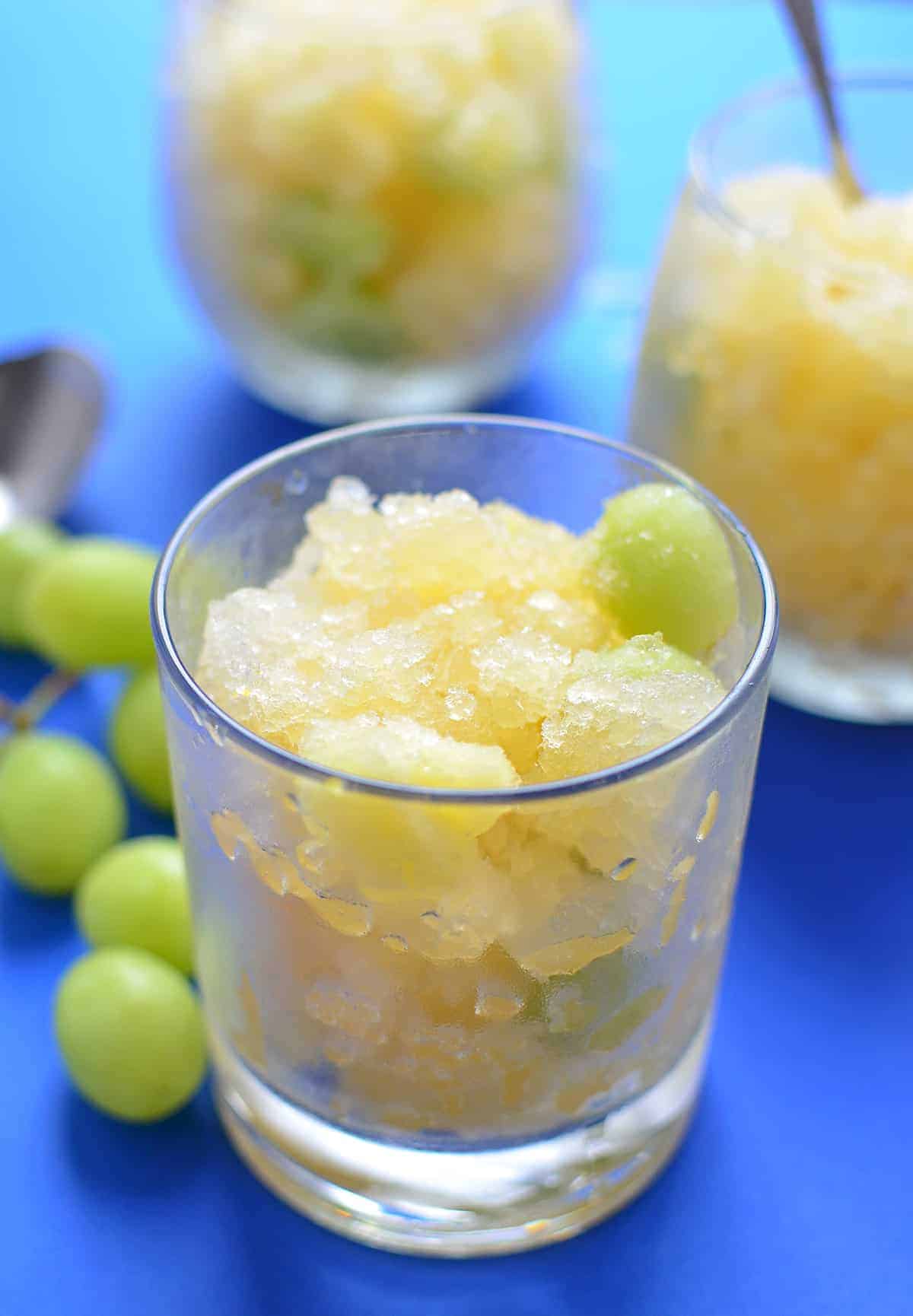 White Sangria Slush! One part sno-cone, one part healthy dessert. Serve this at your next cookout to please both the kids AND the adults. Vegan, Gluten-Free, Naturally sweetened. | www.delishknowledge.com