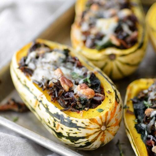 Wild Rice, Kale And Cranberry Stuffed Delicata Squash. The Perfect Vegetarian Main Dish. Roasted Squash Stuffed With Wild Rice, Kale, Pecans, Cranberries And Topped With Cheese. Gluten-Free | Www.delishknowledge.com