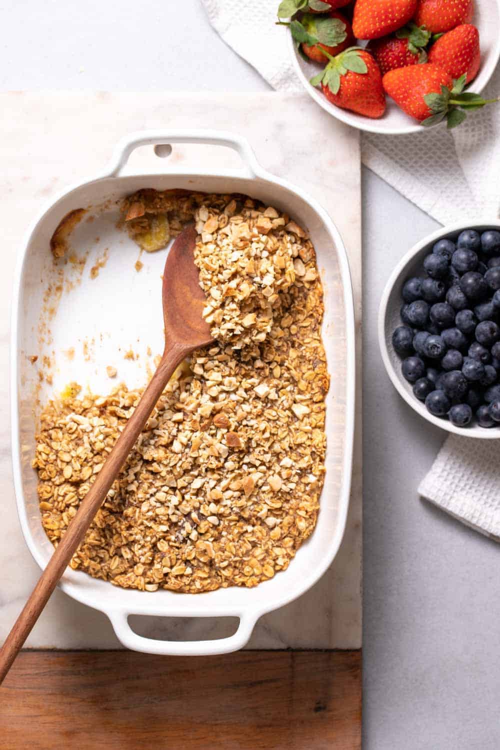 Half Eaten Oatmeal With A Wooden Spoon