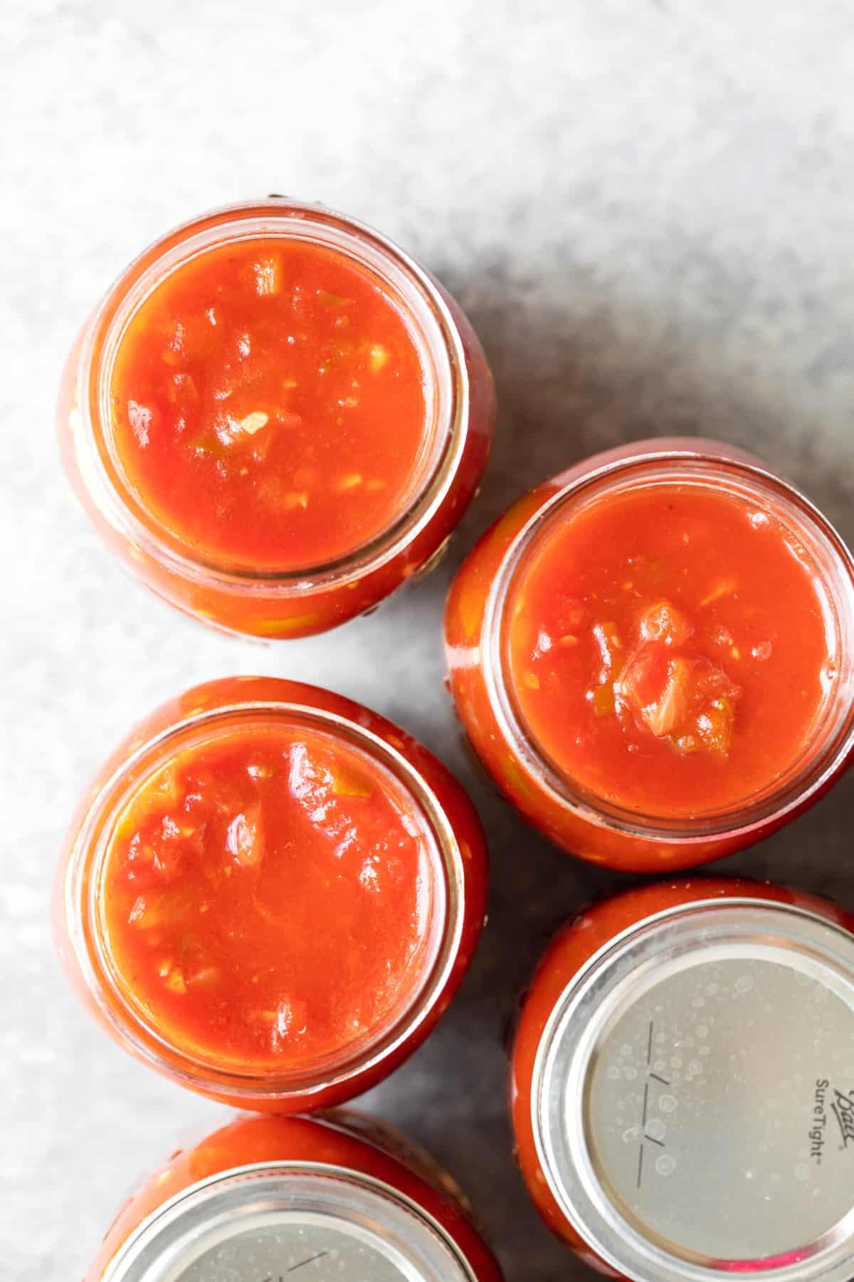 Overhead Image Of Salsa In Glass Jars 