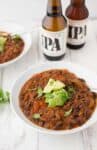 Black Bean & Beer Chili! A hearty vegetarian chili loaded with mushrooms, beans, peppers and simmered in a tangy beer sauce. Vegan and Gluten-free| www.delishknowledge.com