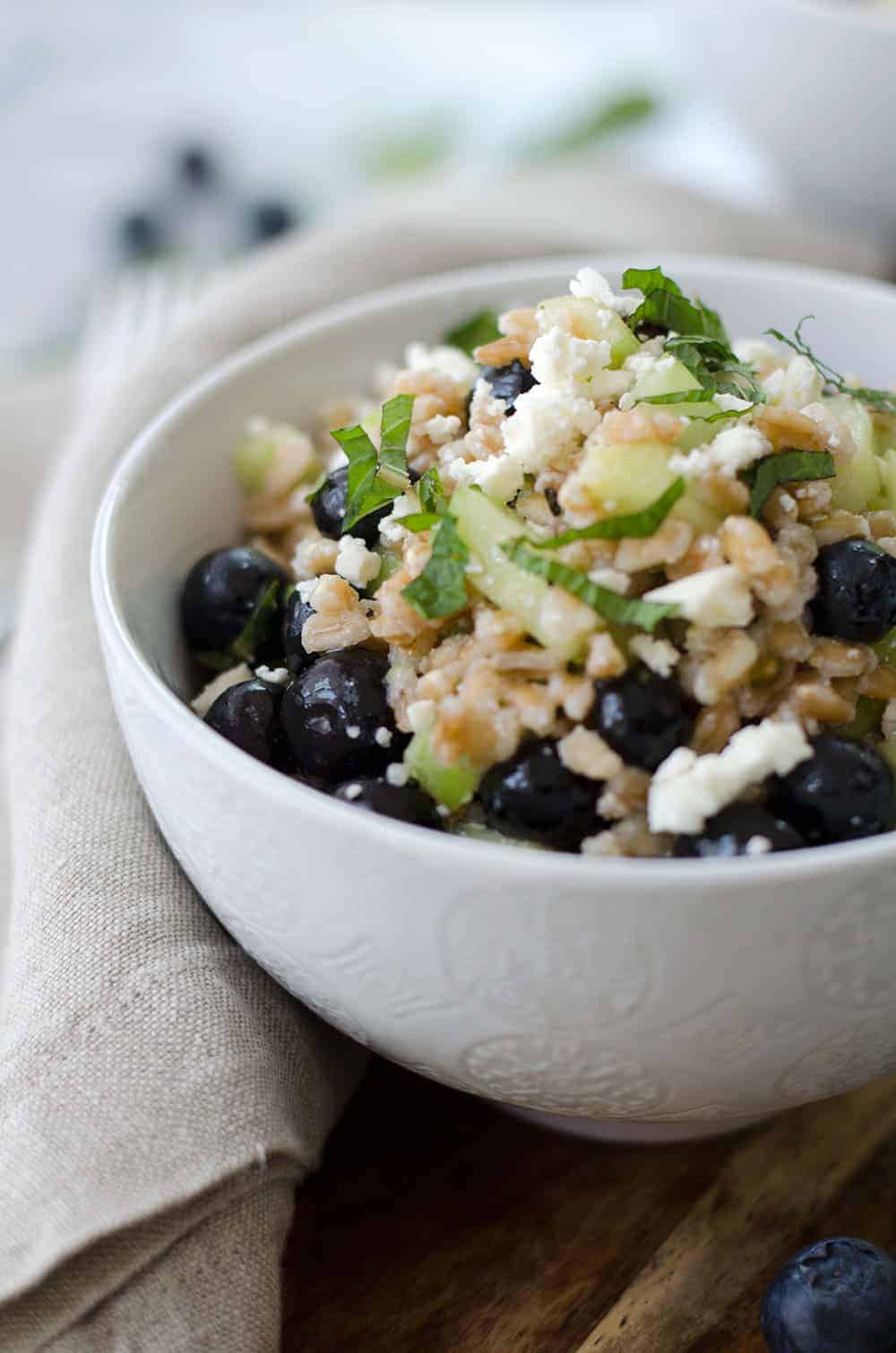 Blueberry Farro Salad! This Sweet And Salty Salad Is Perfect For Summer Entertaining! Fresh Blueberries, Chewy Farro, Cucumber And Feta In A Lemon-Mint Dressing. Vegetarian | Www.delishknowledge.com