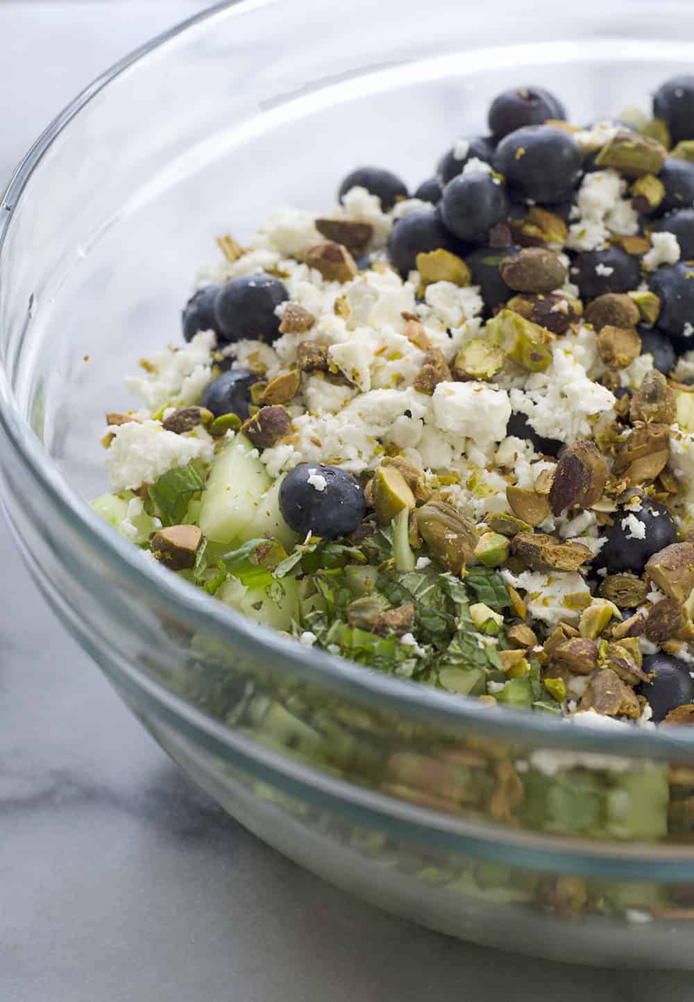 Blueberry Farro Salad! This Sweet And Salty Salad Is Perfect For Summer Entertaining! Fresh Blueberries, Chewy Farro, Cucumber And Feta In A Lemon-Mint Dressing. Vegetarian | Www.delishknowledge.com