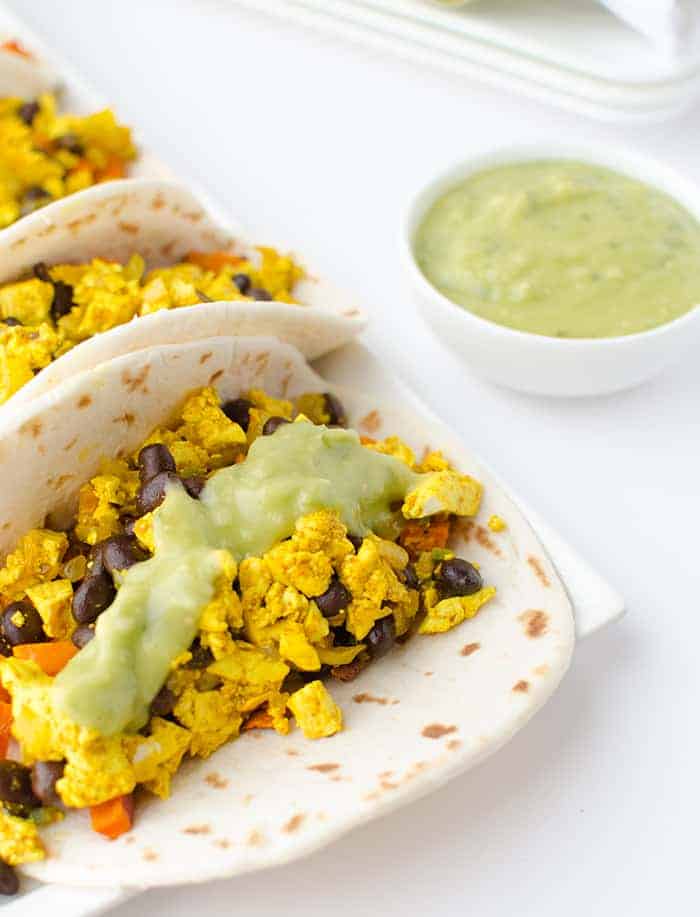 Vegan breakfast tacos! High protein and full of fiber: pepper scramble, roasted sweet potatoes and avocado-verde sauce - plant based breakfast ideas