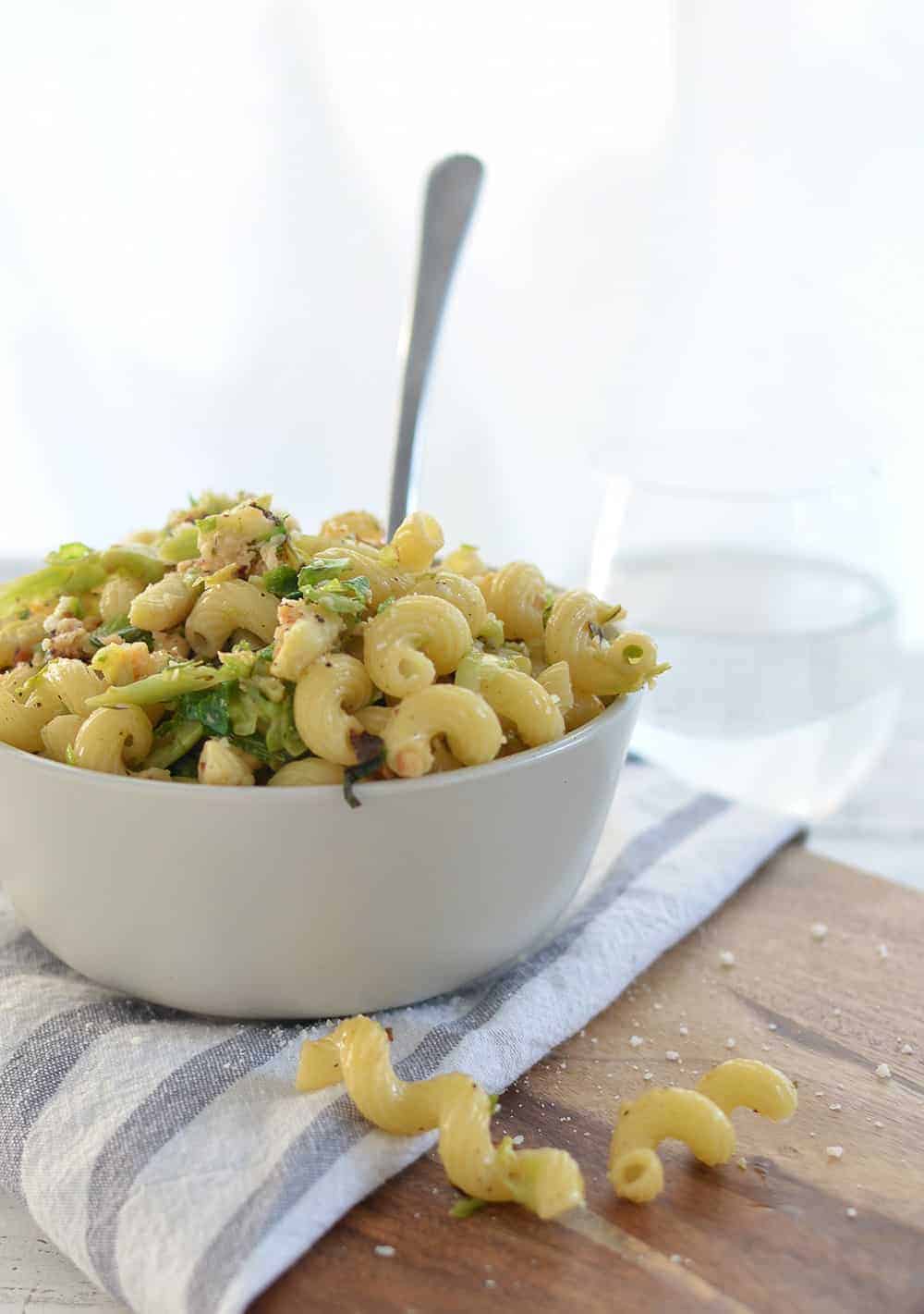 Brussels Sprout and Brown Butter Pasta! A must-make this holiday, so simple and delicious! Crispy brussels sprouts tossed with crunchy nuts, cheese, pasta and browned butter. | www.delishknowledge.com