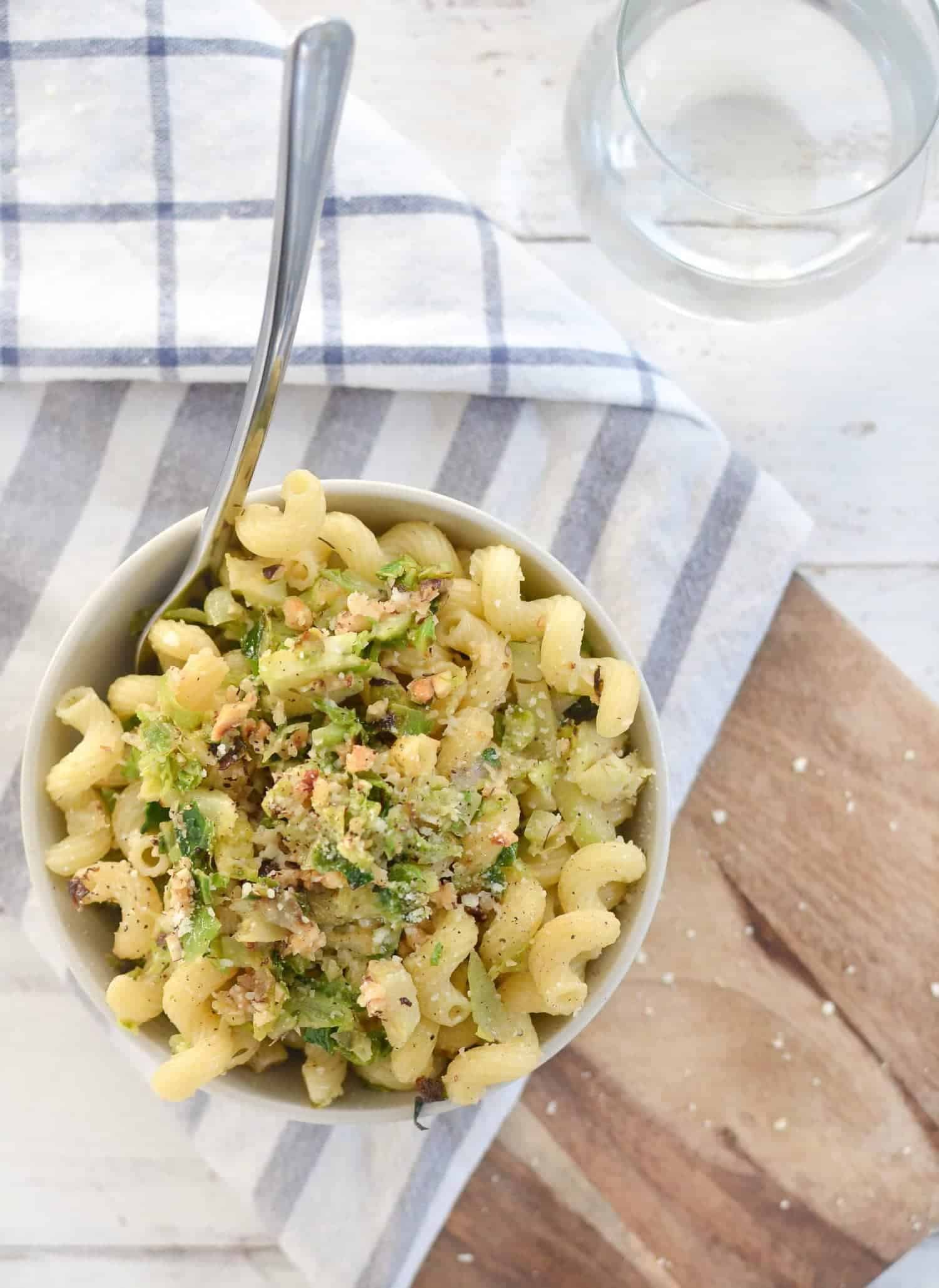 Brussels Sprout and Brown Butter Pasta! A must-make this holiday, so simple and delicious! Crispy brussels sprouts tossed with crunchy nuts, cheese, pasta and browned butter. | www.delishknowledge.com