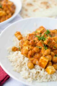 Slow Cooker Butter Chickpeas and Tofu! Packed with protein, vegan and gluten free. A healthier take on everyone's favorite Indian dish. This is such a simple dish; the perfect make-ahead healthy weeknight dinner. | www.delishknowledge.com