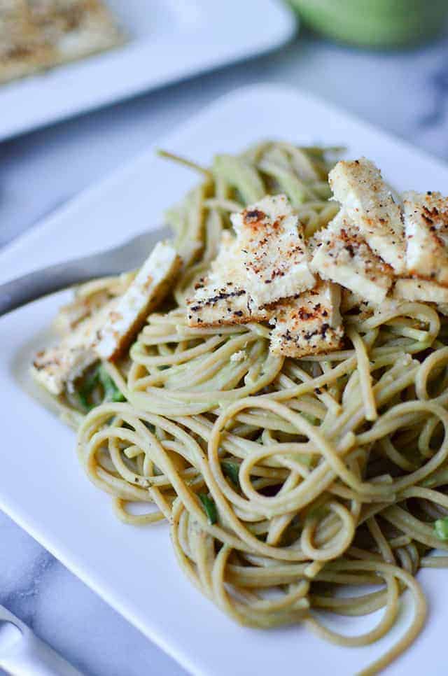 Cauliflower Pesto Pasta! Creamy, dairy-free pesto-cauliflower sauce with seared tofu and whole-wheat pasta