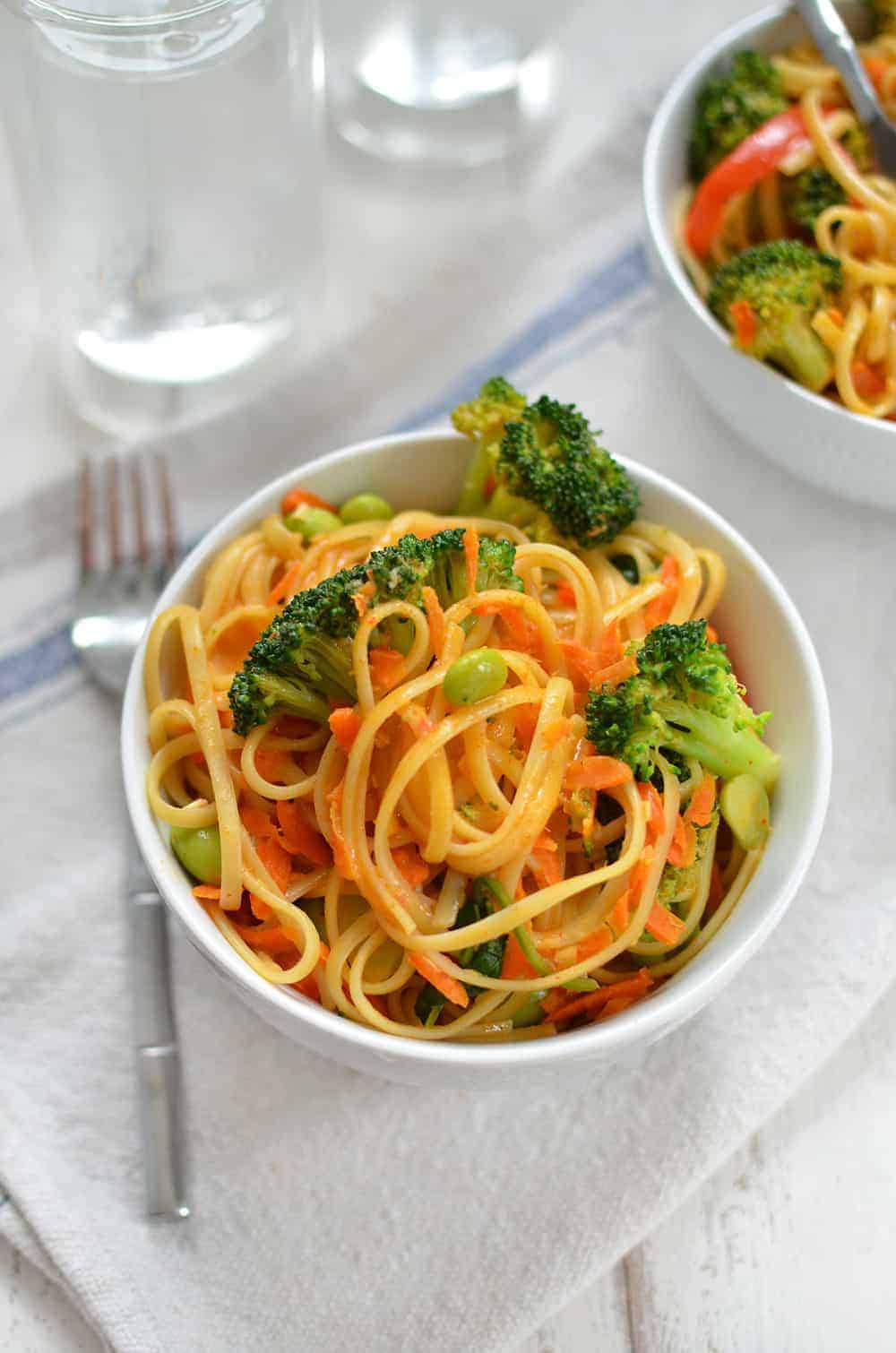 Vegan Coconut Curry Noodle Bowls! 2 Servings Of Vegetables In Every Bowl! Linguini & Vegetables Simmered In A Coconut Red Curry Sauce. Ready In Less Than 30 Minutes! | Www.delishknowledge.com