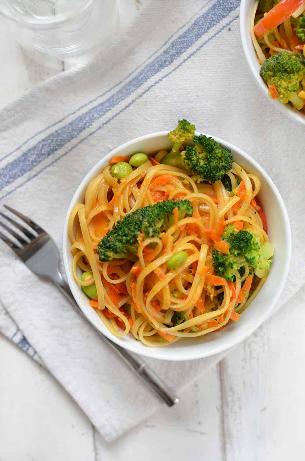 Vegan Coconut Curry Noodle Bowls! 2 Servings Of Vegetables In Every Bowl! Linguini & Vegetables Simmered In A Coconut Red Curry Sauce. Ready In Less Than 30 Minutes! | Www.delishknowledge.com