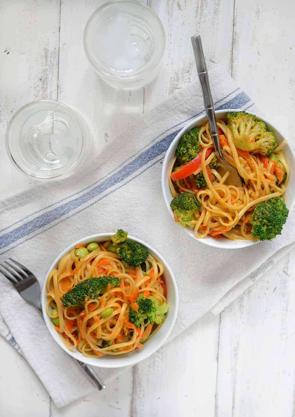 Vegan Coconut Curry Noodle Bowls! 2 Servings Of Vegetables In Every Bowl! Linguini & Vegetables Simmered In A Coconut Red Curry Sauce. Ready In Less Than 30 Minutes! | Www.delishknowledge.com