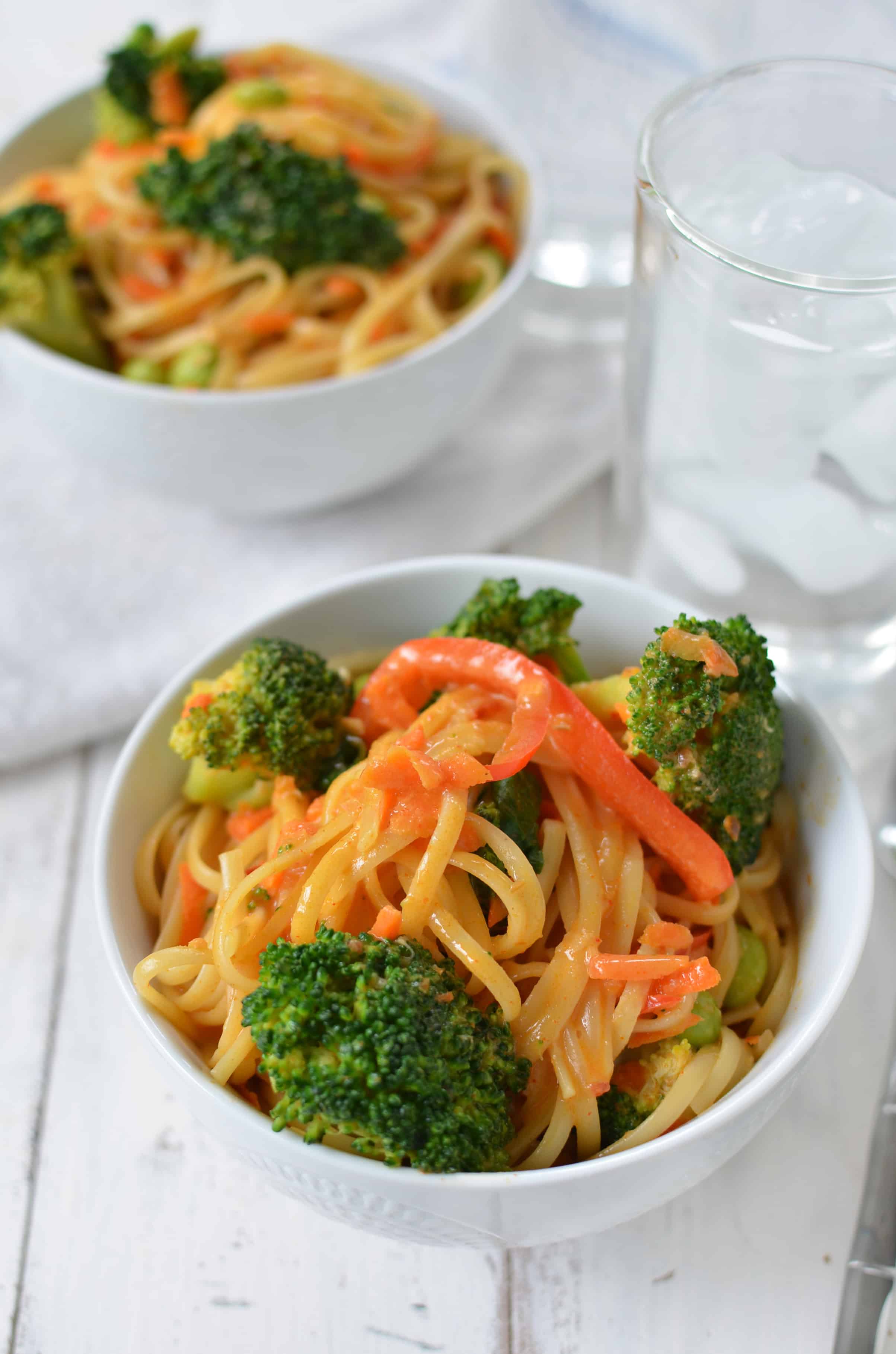 Vegan Coconut Curry Noodle Bowls! 2 Servings Of Vegetables In Every Bowl! Linguini & Vegetables Simmered In A Coconut Red Curry Sauce. Ready In Less Than 30 Minutes! | Www.delishknowledge.com