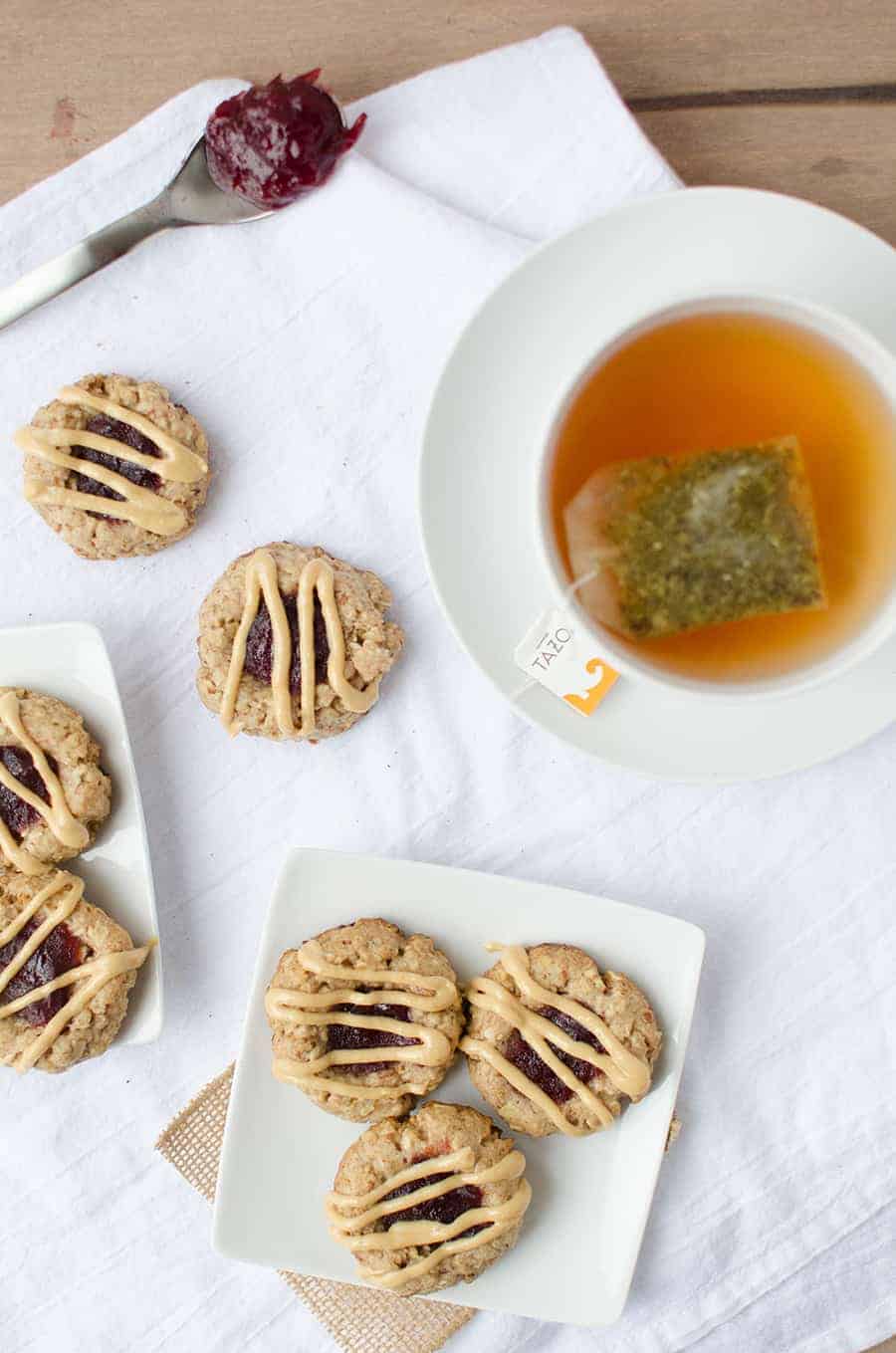 Thumbprint Cookies! Pecan Cookies Topped With Cranberry Jam And Peanut Butter Drizzle. Wholesome, Naturally Sweetened And Vegan! | Www.delishknowledge.com