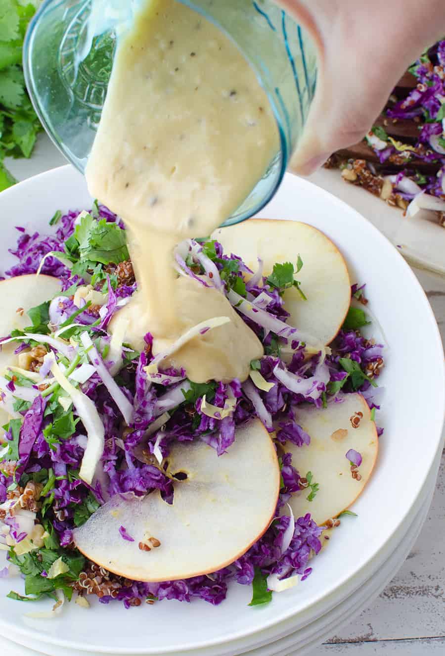 Winter Slaw! So, so good! Cabbage, Endive, Apples, Parsley, Walnut and Quinoa is a lemony-tahini sauce. Such a healthy side dish or main | www.delishknowledge.com