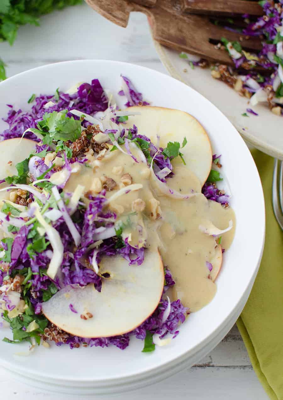 Winter Slaw! So, so good! Cabbage, Endive, Apples, Parsley, Walnut and Quinoa is a lemony-tahini sauce. Such a healthy side dish or main | www.delishknowledge.com