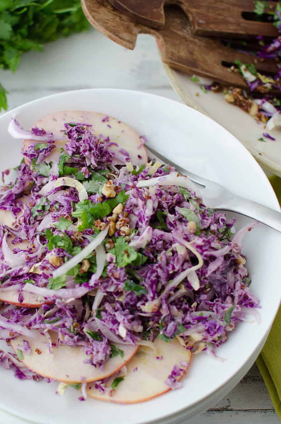 Winter Slaw! So, so good! Cabbage, Endive, Apples, Parsley, Walnut and Quinoa is a lemony-tahini sauce. Such a healthy side dish or main | www.delishknowledge.com