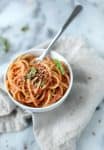 Fresh Tomato Sauce with Spaghetti! This cheaters pomodoro is the only recipe you need for summer tomatoes! A trick for perfect tomato sauce without any fancy tools. Ready in just 20 minutes! Vegan and vegetarian. | www.delishknowledge.com