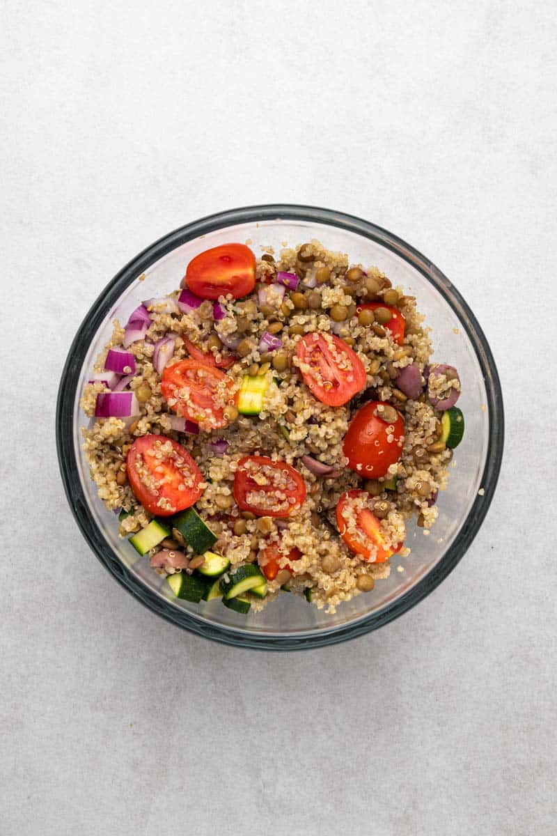 Greek Lentil Salad Ingredients Tossed In Bowl