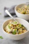 Grilled Corn, Poblano and Potato Salad! A must-make for summer BBQs and potlucks. Grilled corn, potato and poblano peppers mixed with a dairy-free basil dressing. Vegan and Gluten-Free | www.delishknowledge.com