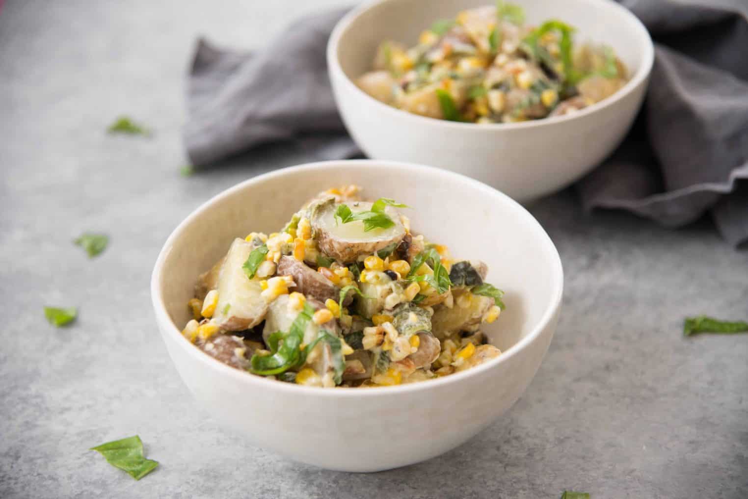 Grilled Corn, Poblano and Potato Salad! A must-make for summer BBQs and potlucks. Grilled corn, potato and poblano peppers mixed with a dairy-free basil dressing. Vegan and Gluten-Free | www.delishknowledge.com