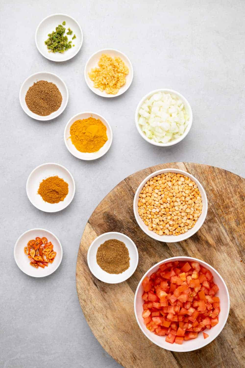 Raw Ingredients For The Dal On A Wooden Board