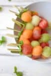 Melon Ball Skewers with Basil-Mint Dressing. A refreshing snack or dessert for summer! Vegan and Gluten-Free | www.delishknowledge.com