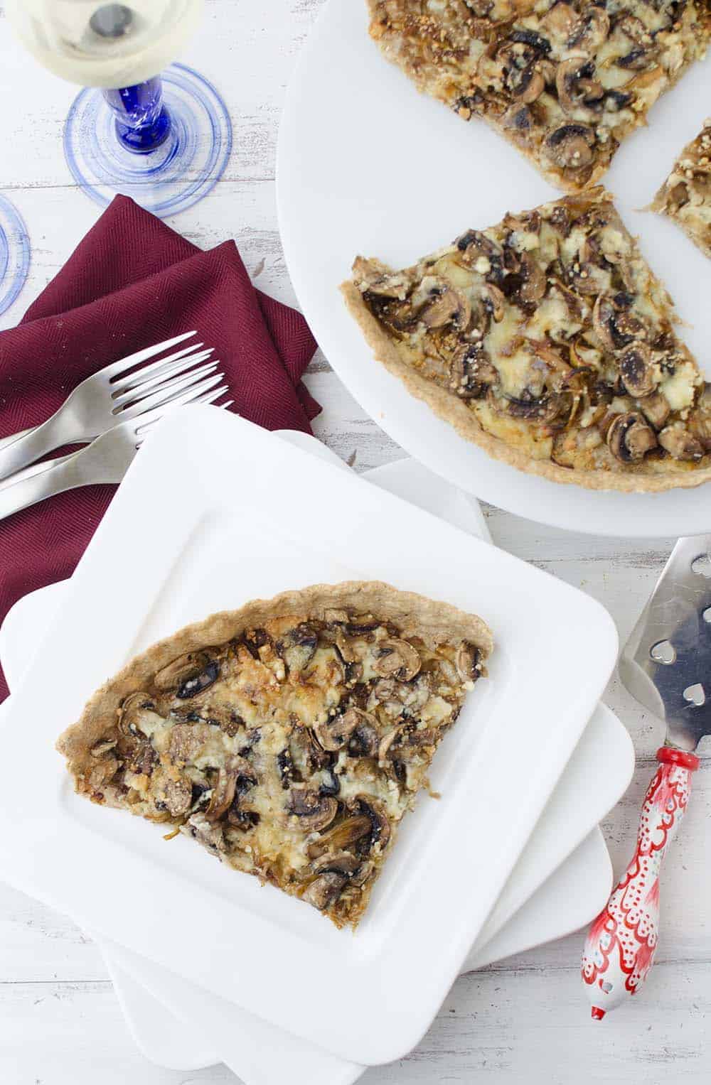Caramelized onion and mushroom tart! The perfect vegetarian appetizer, side or main dish. Whole wheat tart stuffed with onions, mushrooms, and gorgonzola cheese. | www.delishknowledge.com