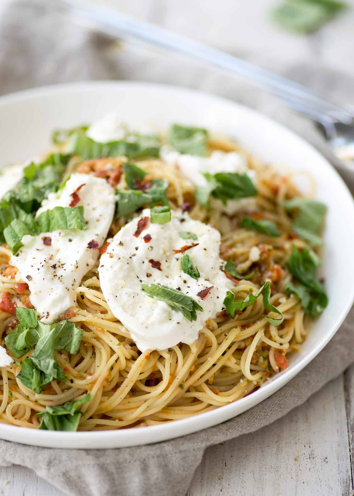 Pasta Checca With Burrata! This Recipe Is Ready In Less Than 20 Minutes. Quick, No-Cook Sauce Tossed With Hot Angelhair Pasta And Topped With Creamy Burrata. Vegetarian. | Www.delishknowledge.com