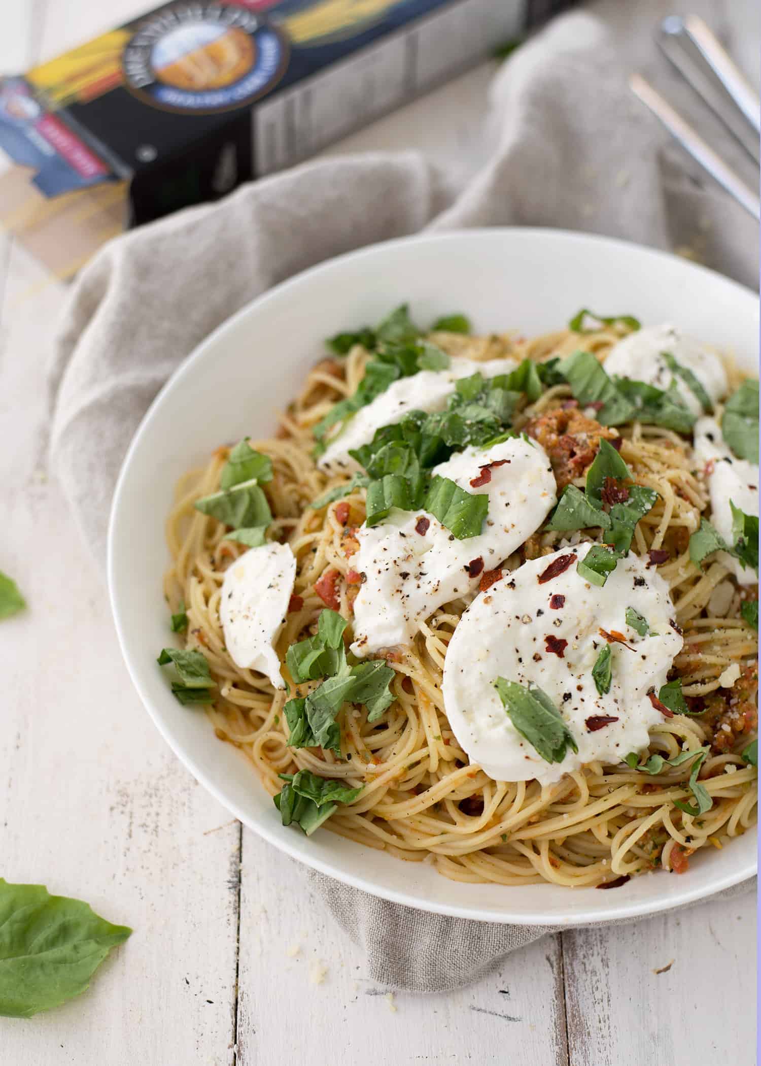 Pasta Checca With Burrata! This Recipe Is Ready In Less Than 20 Minutes. Quick, No-Cook Sauce Tossed With Hot Angelhair Pasta And Topped With Creamy Burrata. Vegetarian. | Www.delishknowledge.com