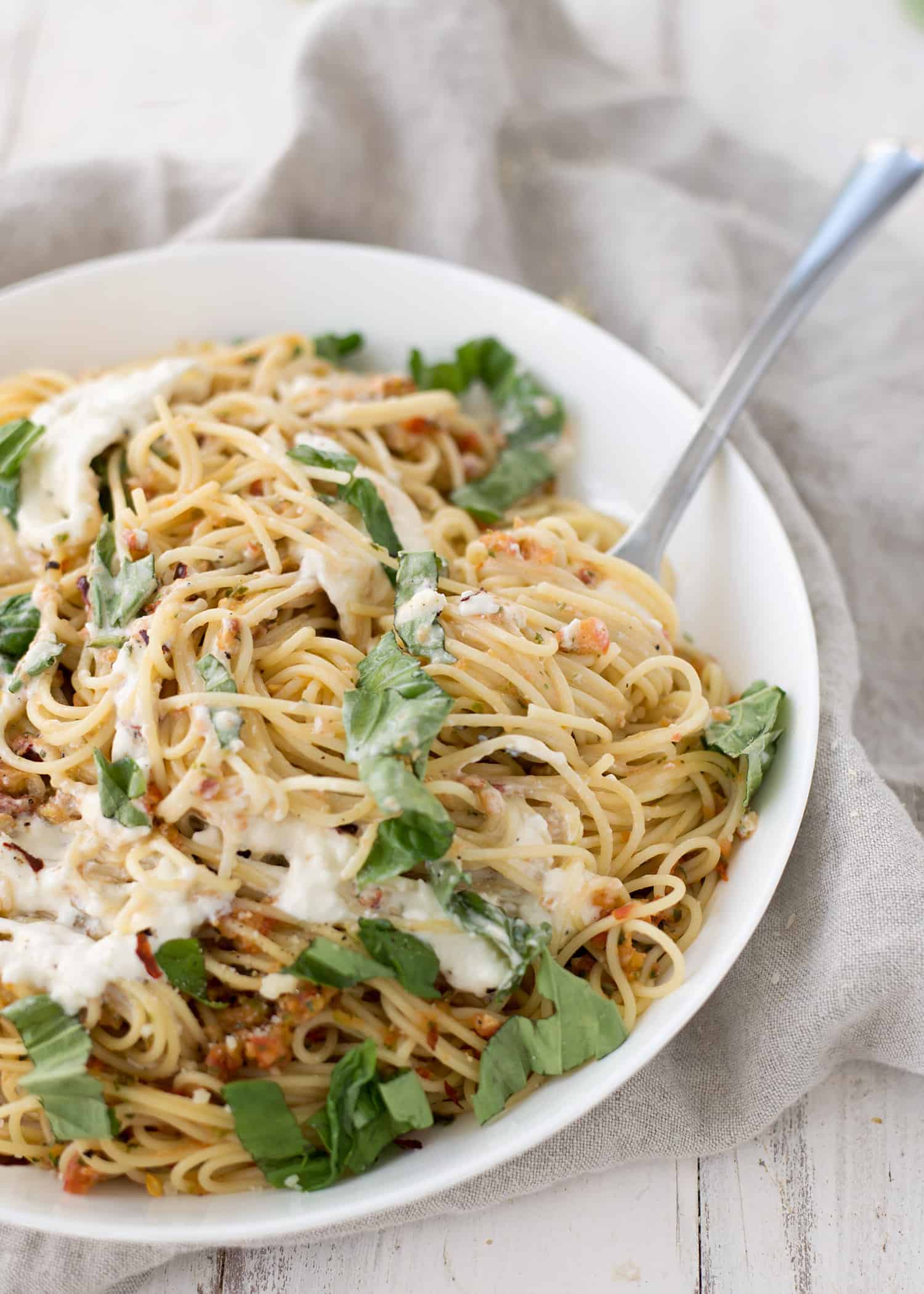 Pasta Checca With Burrata! This Recipe Is Ready In Less Than 20 Minutes. Quick, No-Cook Sauce Tossed With Hot Angelhair Pasta And Topped With Creamy Burrata. Vegetarian. | Www.delishknowledge.com