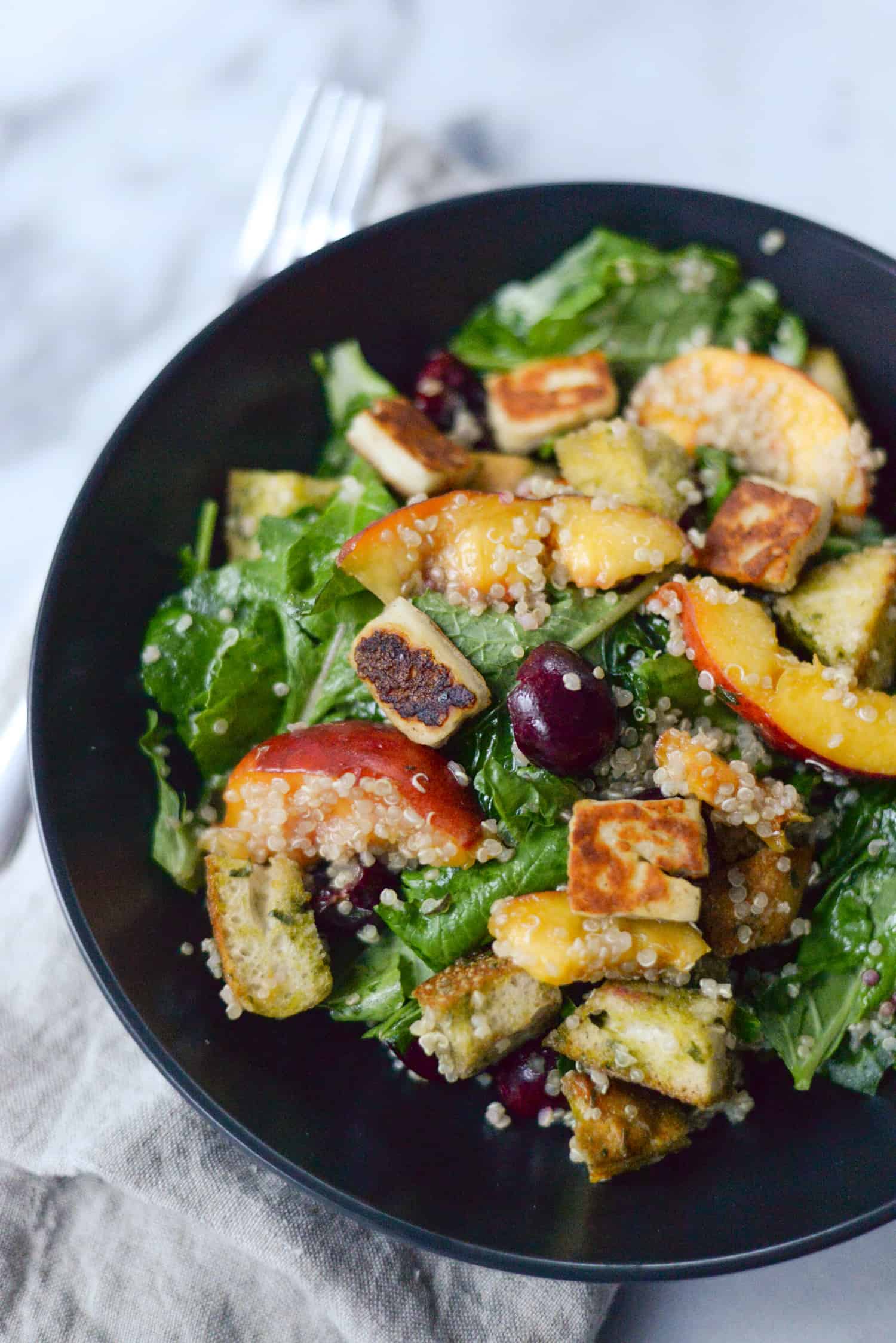 Peach, Cherry And Halloumi Salad! This Vibrant Salad Is Perfect For Summer. Fresh Produce, Grilled Halloumi Cheese, Quinoa, Pecans And A Balsamic Vinegar. Vegetarian & Gluten-Free | Www.delishknowledge.com