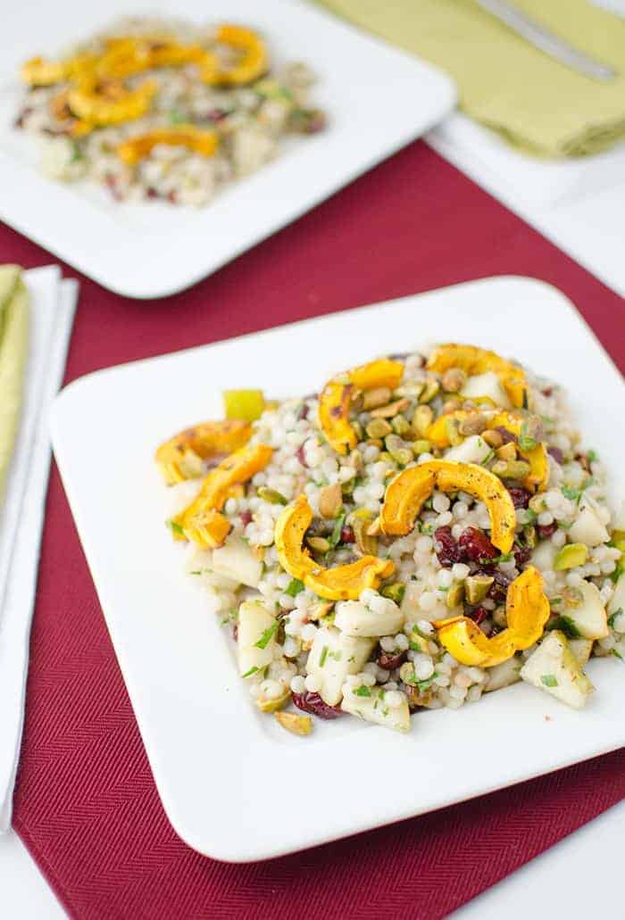 Fall Salad! Healthy, vegan. Israeli couscous tossed with roasted delicata squash, cranberries, pistachios, and pear. Maple Apple Dressing! | www.delishknowledge.com