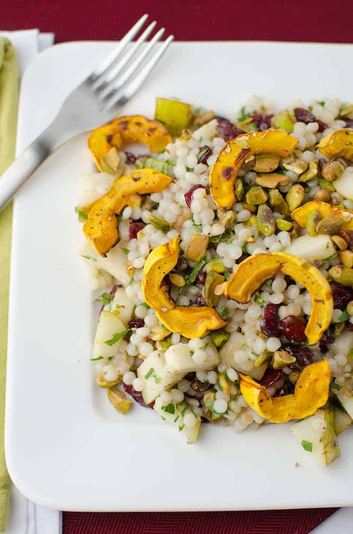 Fall Salad! Healthy, vegan. Israeli couscous tossed with roasted delicata squash, cranberries, pistachios, and pear. Maple Apple Dressing! | www.delishknowledge.com