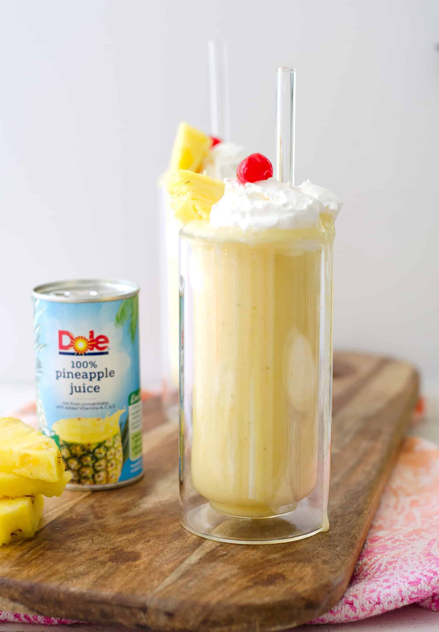 Pina Colada Smoothie! This refreshing smoothie is perfect for hot summer days- with or without rum! Vegan, dairy-free and gluten-free | www.delishknowledge.com