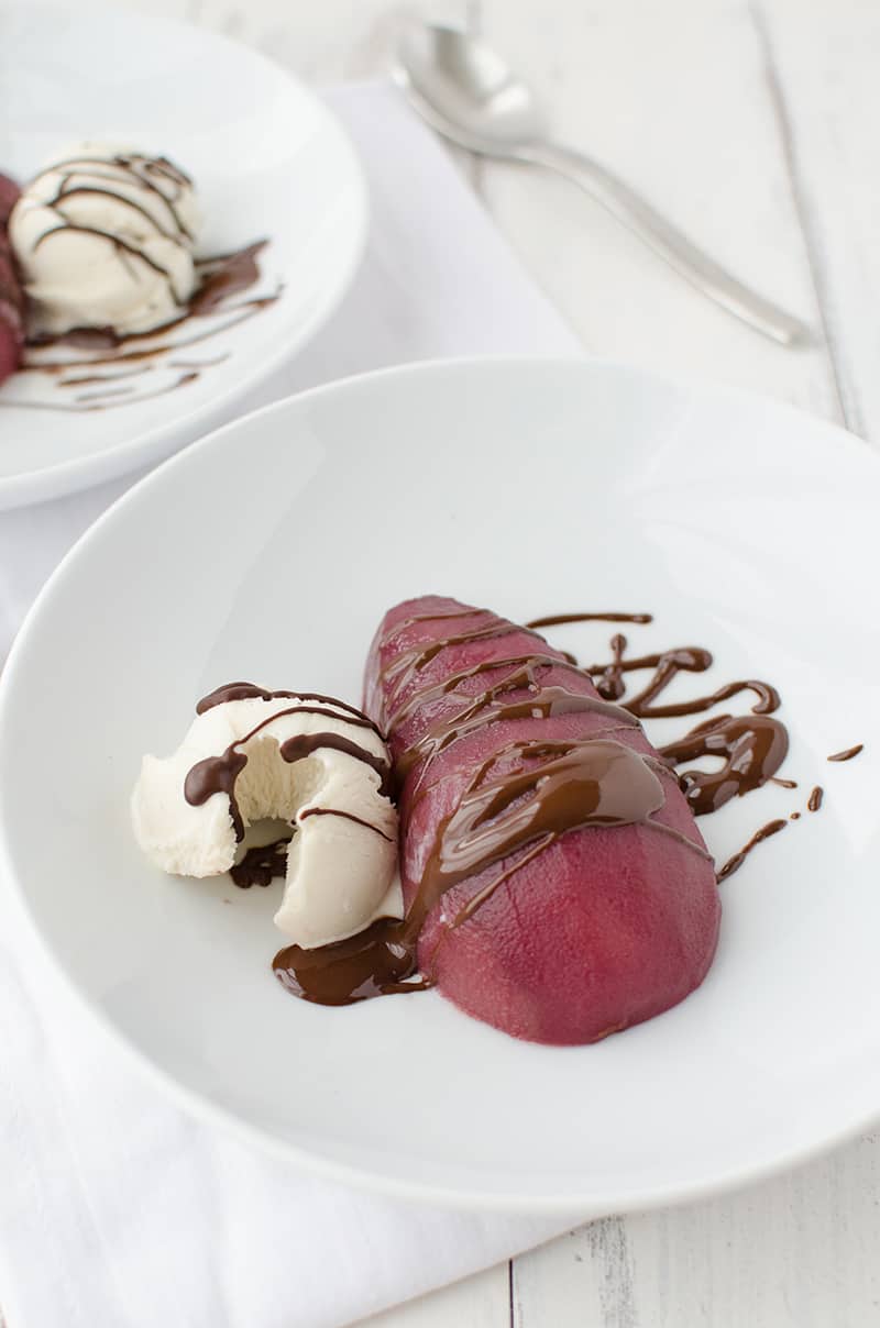 Serve The Poached Pears With Some Ice Cream And A Chocolate Sauce