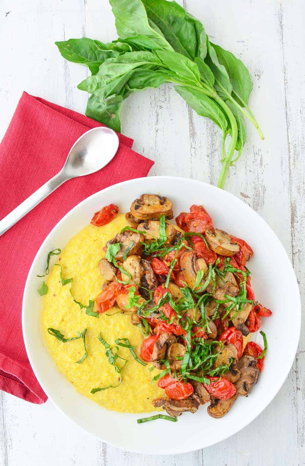 Weeknight Comfort Food! Cheesy Polenta Bowl Topped With Roasted Tomatoes And Mushrooms. Vegan And Gluten-Free. | Www.delishknowledge.com