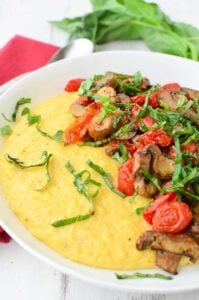 Weeknight Comfort Food! Cheesy Polenta Bowl Topped With Roasted Tomatoes And Mushrooms. Vegan And Gluten-Free. | Www.delishknowledge.com